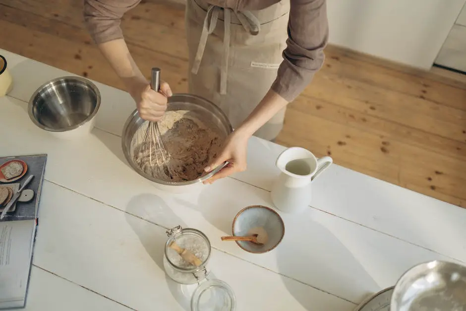 A person mixing cookie dough in a mixing bowl