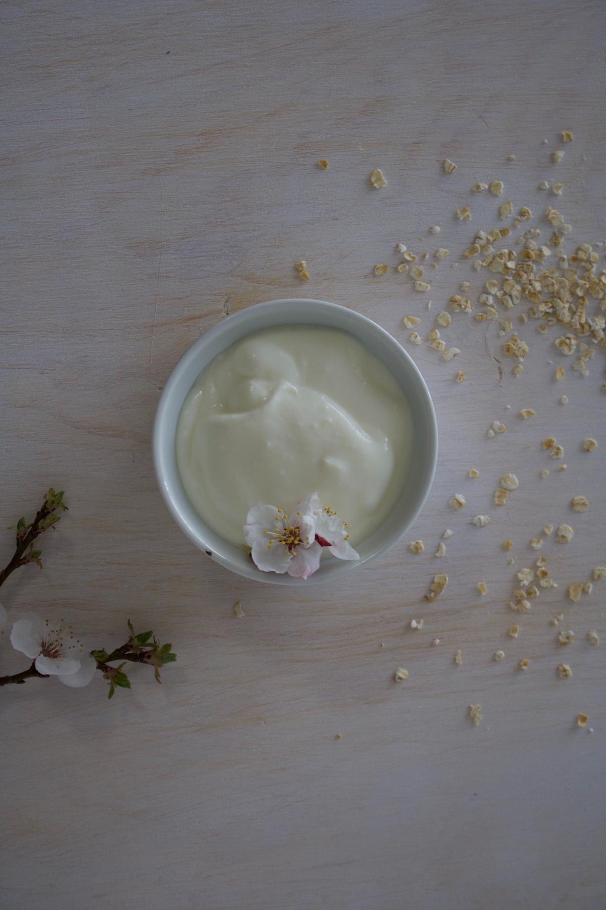 A picture of yogurt and buttermilk next to eggs, with an arrow pointing to the yogurt and buttermilk indicating they can be used as an egg replacer.